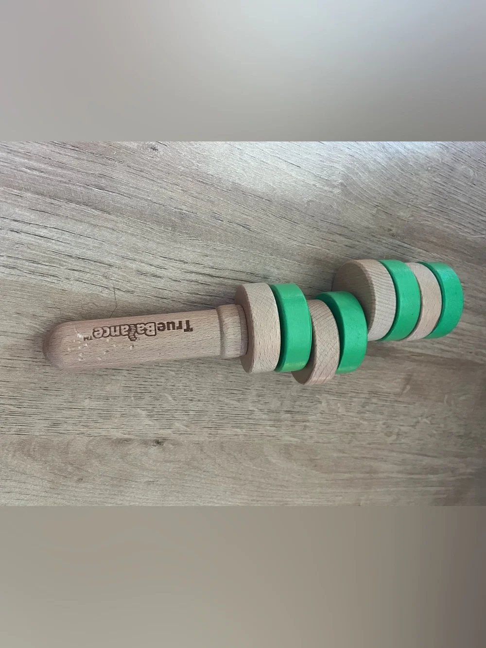 TrueBalance Wooden Stacker Toy in Green – Handheld Ring Trainer